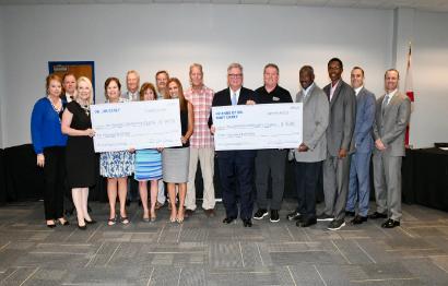 Dr. Bart Carey Scholarship check provided at Sept. 2021 District Board of Trustees meeting