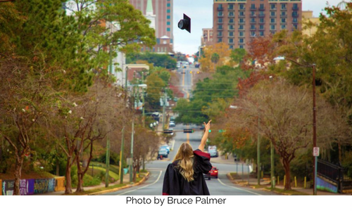 FSU grad throwing their cap in the air, photo taken by Bruce Palmer