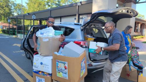 Tallahassee Community College Classified Staff Council representatives deliver schools supplies to Riley Elementary